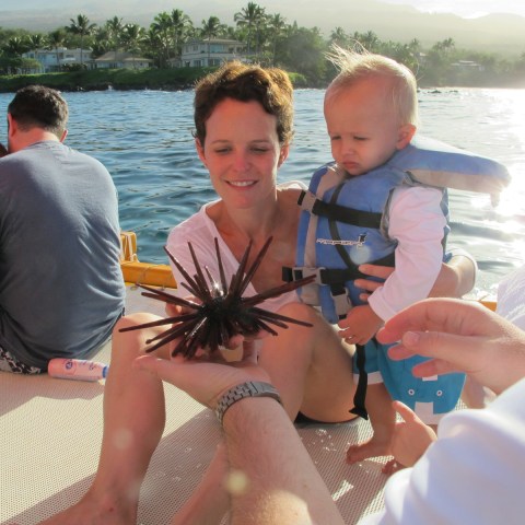 Woman with her child on a canoe
