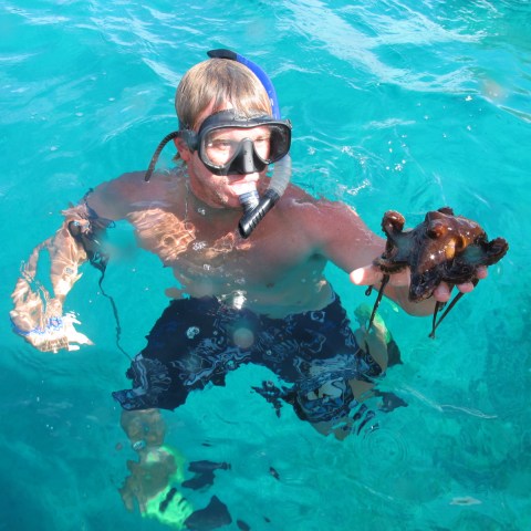 a man swimming in a pool of water