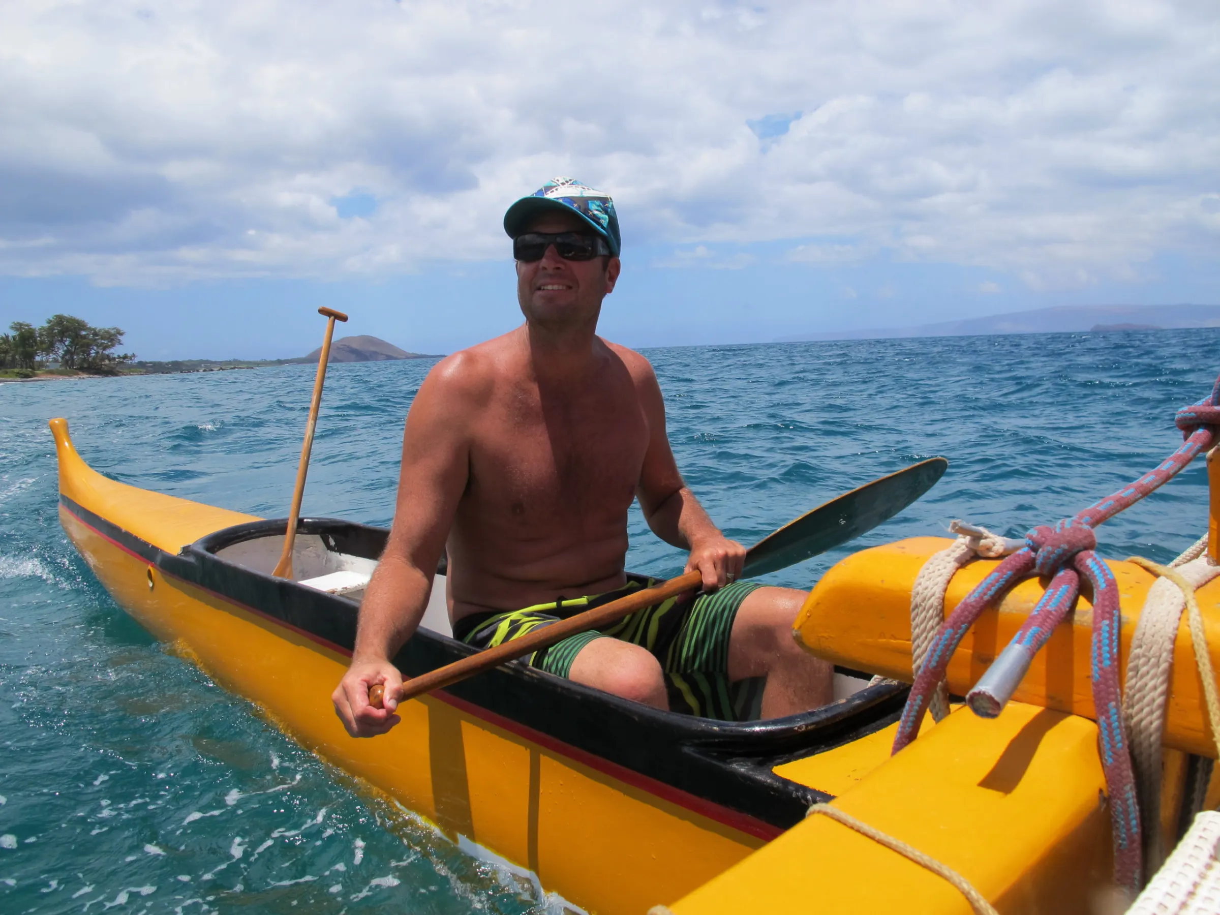 a man riding on the back of a boat