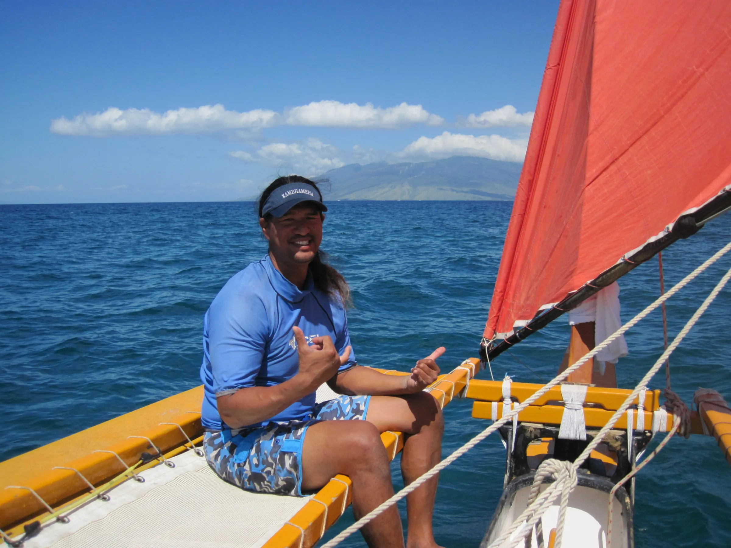 a person sitting in a boat on a body of water