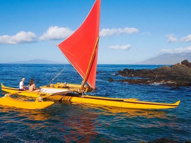 The Tour Image 1 a small boat in a body of water