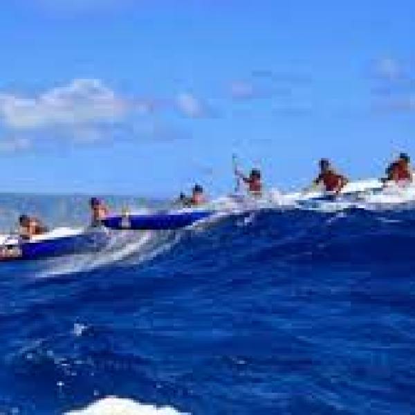 a group of people on a boat in the water