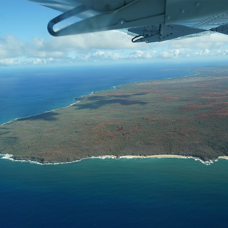 a plane flying over a body of water