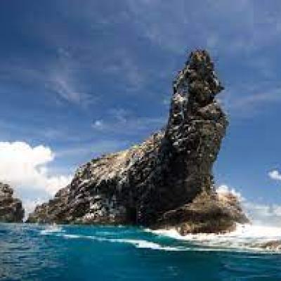 a view of water and a mountain in the background