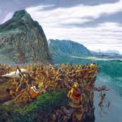 a large body of water with a mountain in the background